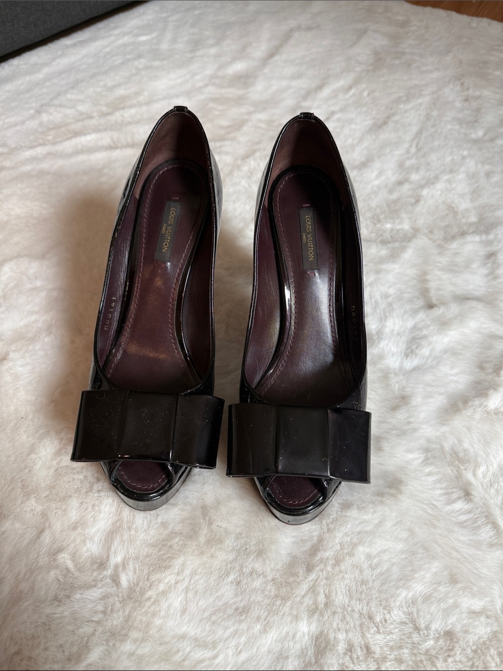 Patent Peep-Toe Heels with Bow Accent in eggplant color.